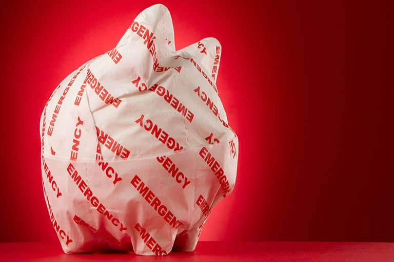 piggy back wrapped in paper with emergency written all over