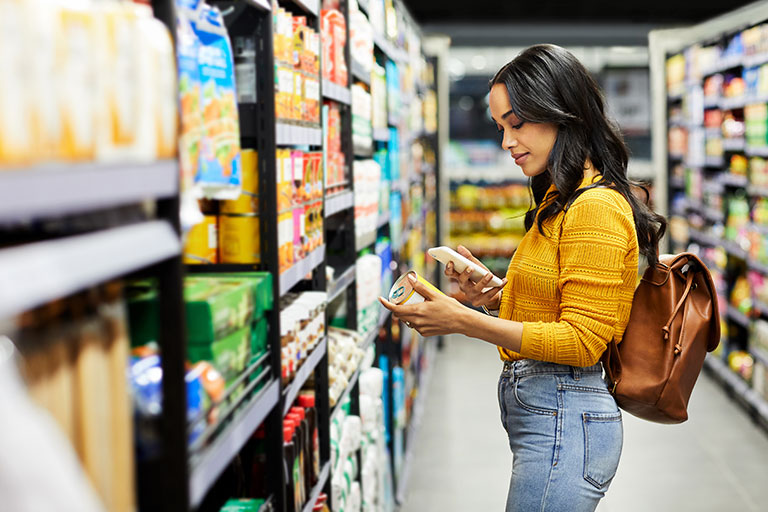 Woman reading grocery label