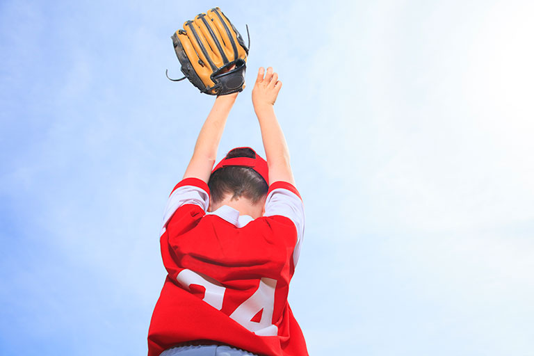 Boy playing baseball.