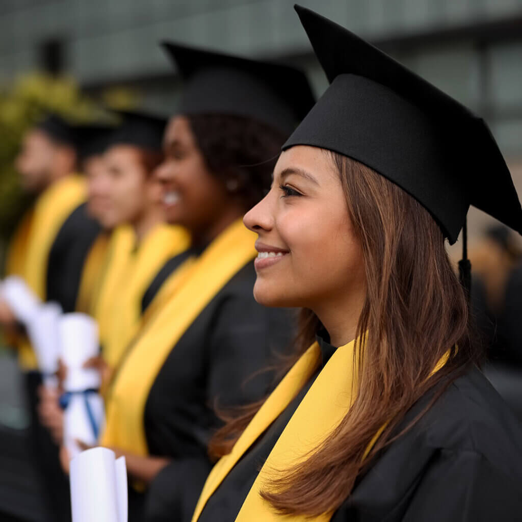 College graduates receiving diplomas