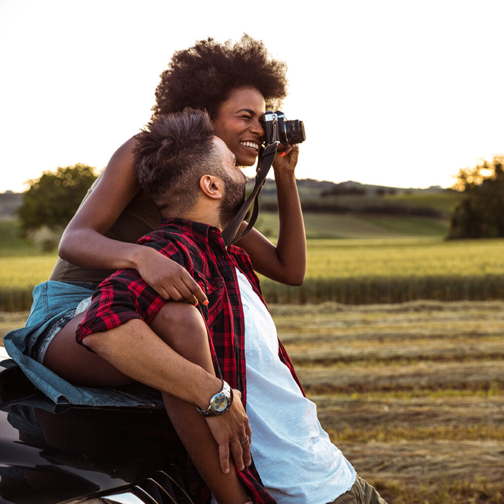 Couple having fun with a camera outside