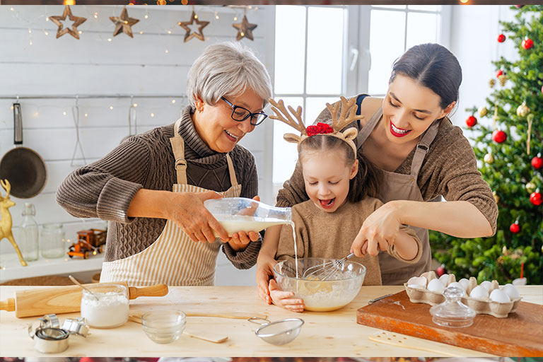 Women baking holiday cookies.