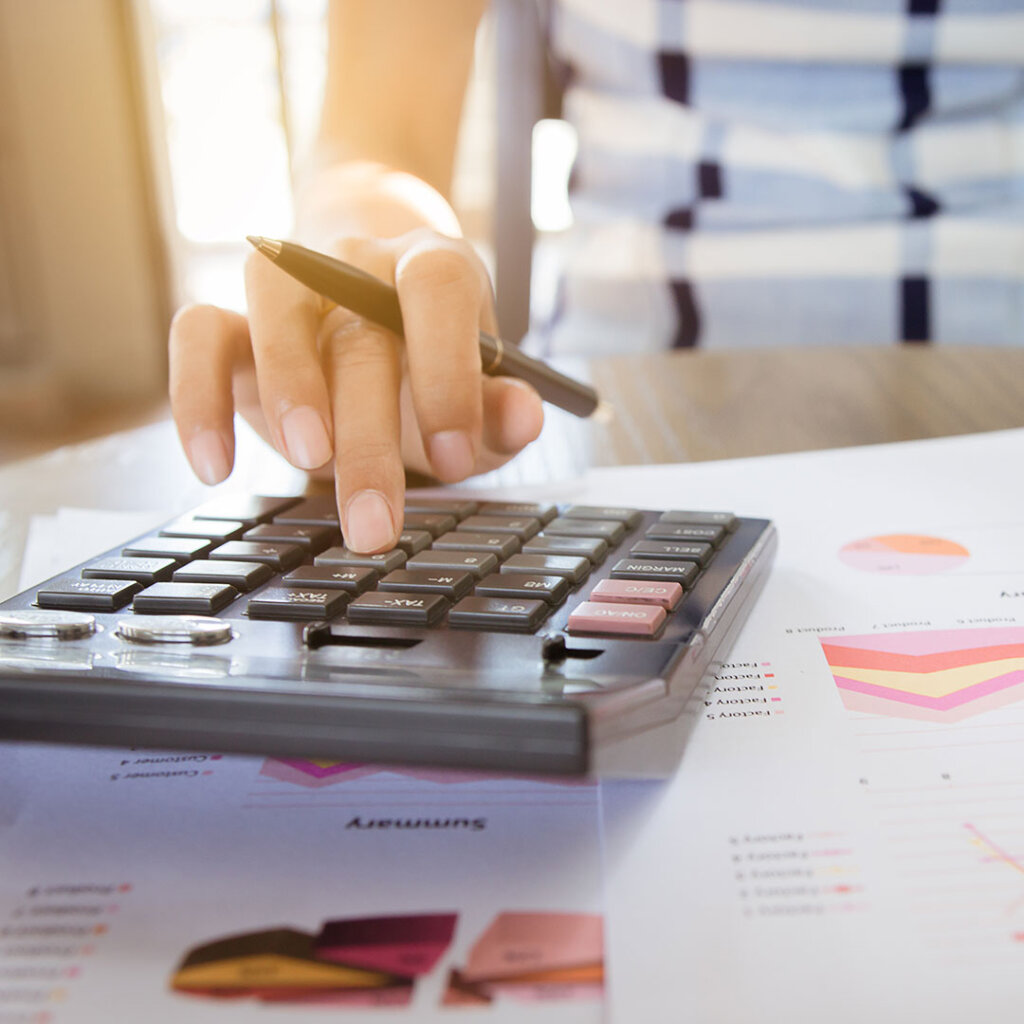 person using a traditional calculator