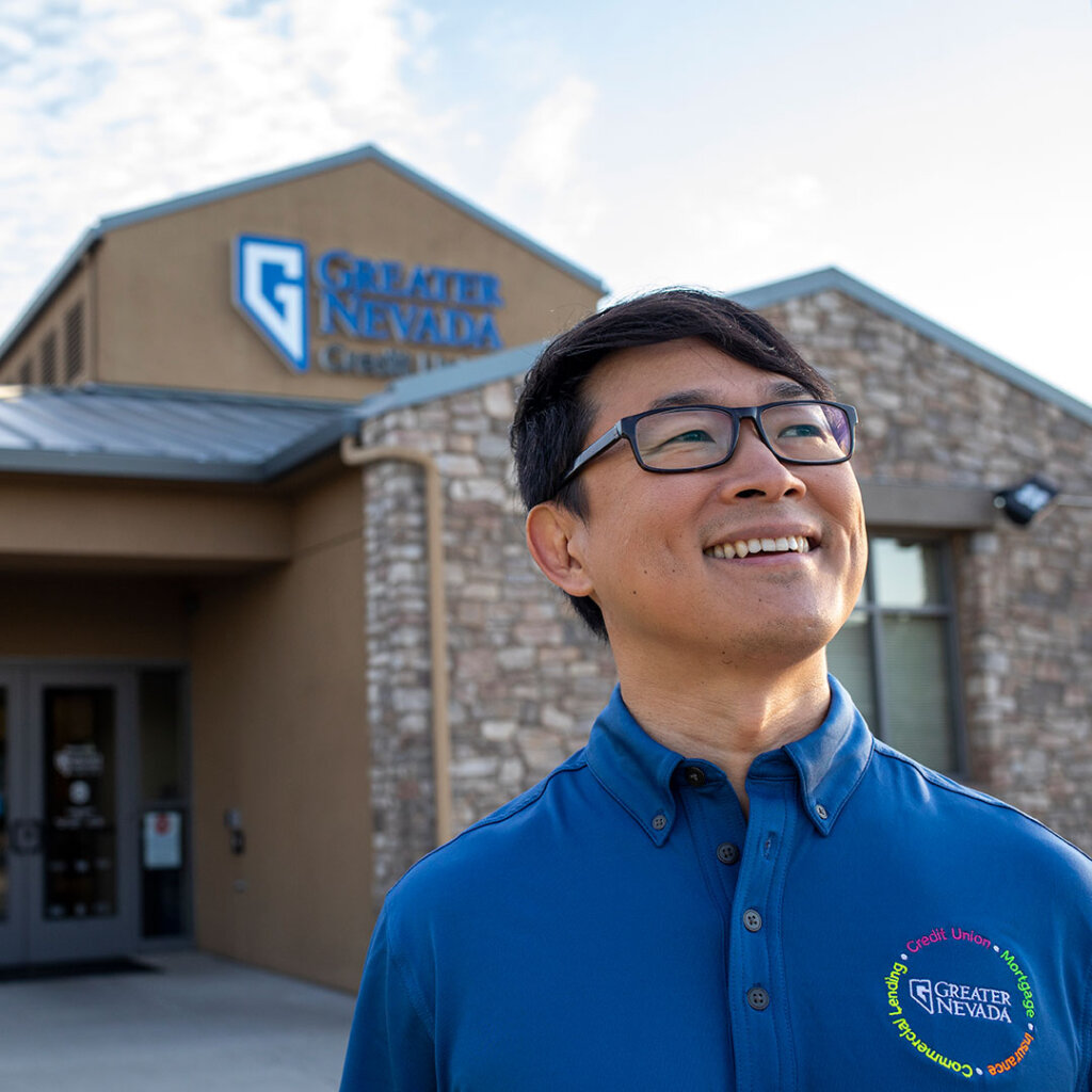 Greater Nevada employee outside of a branch smiling