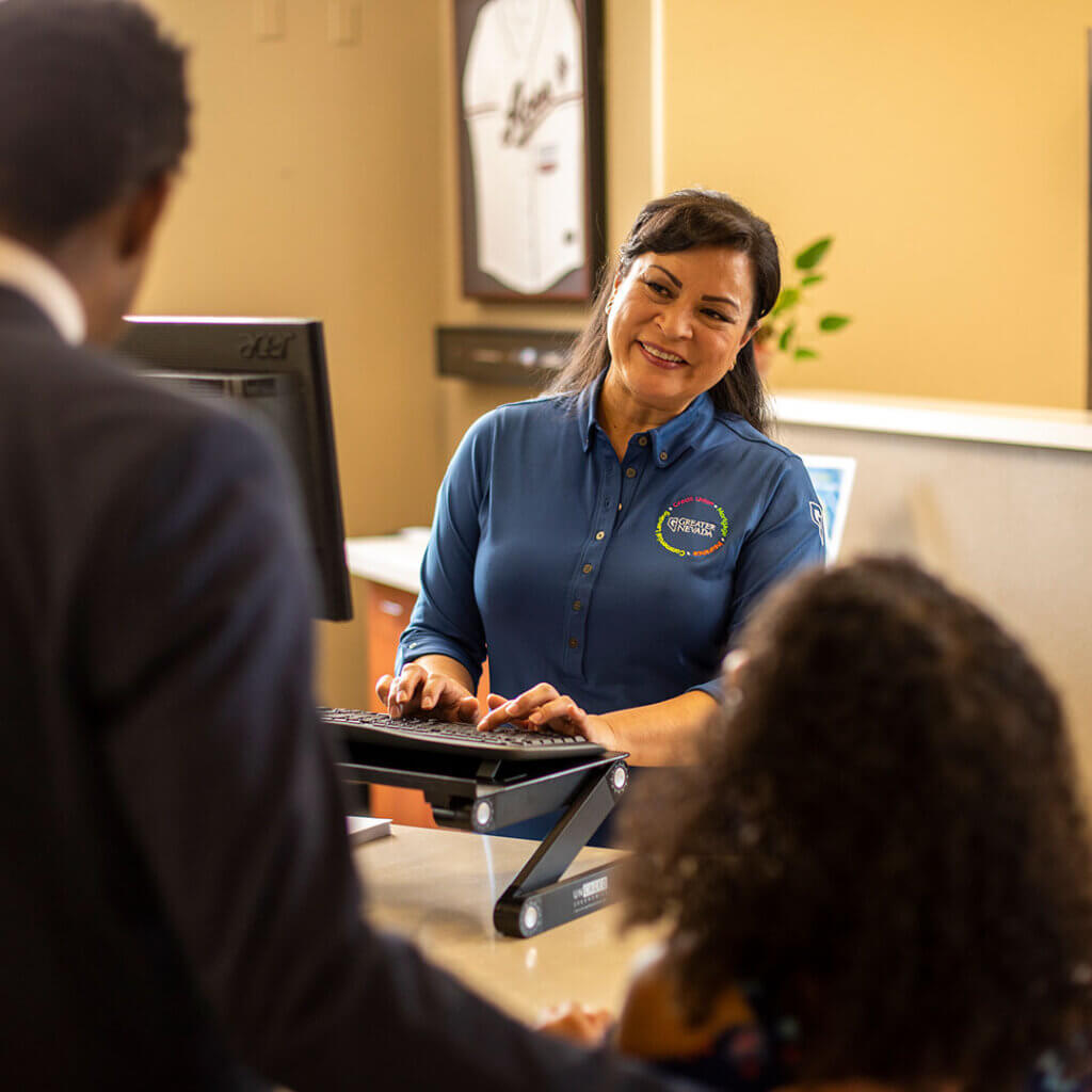 GNCU employee with members at a branch pod