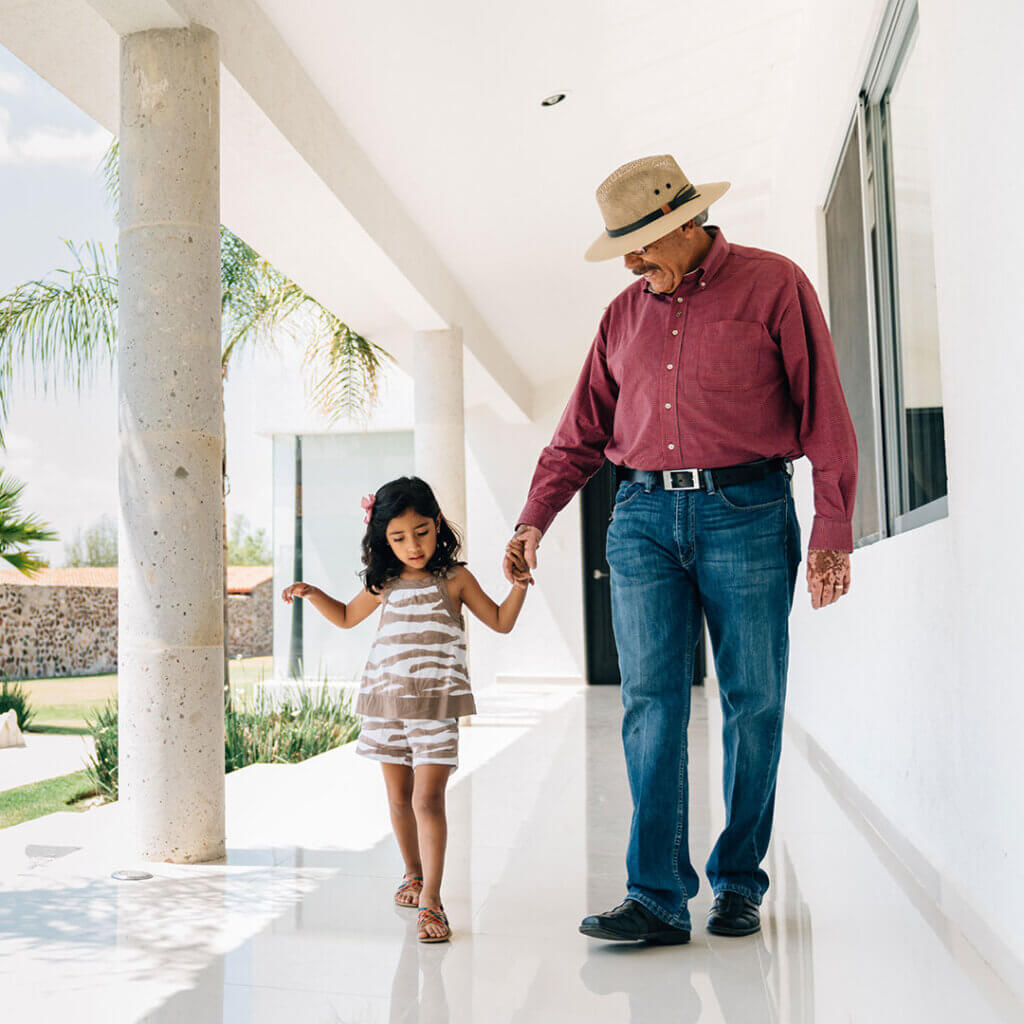 Grandpa holding hands with granddaughter