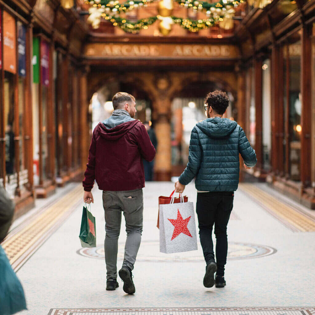 Two men holiday shopping together