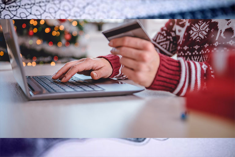Woman holiday shopping online.