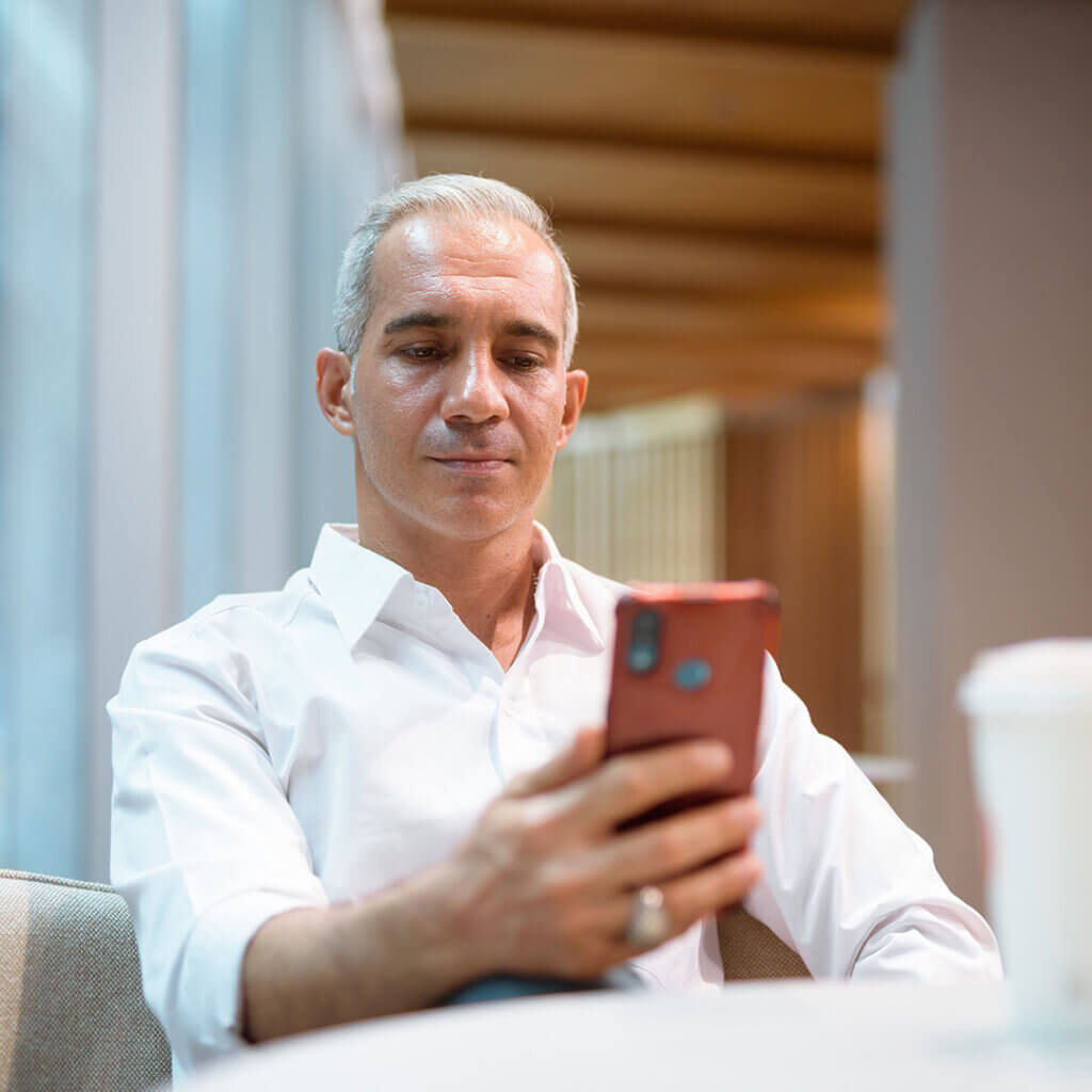 Man looking at his smartphone concerned