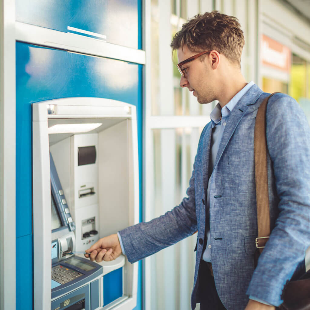 Man using ATM