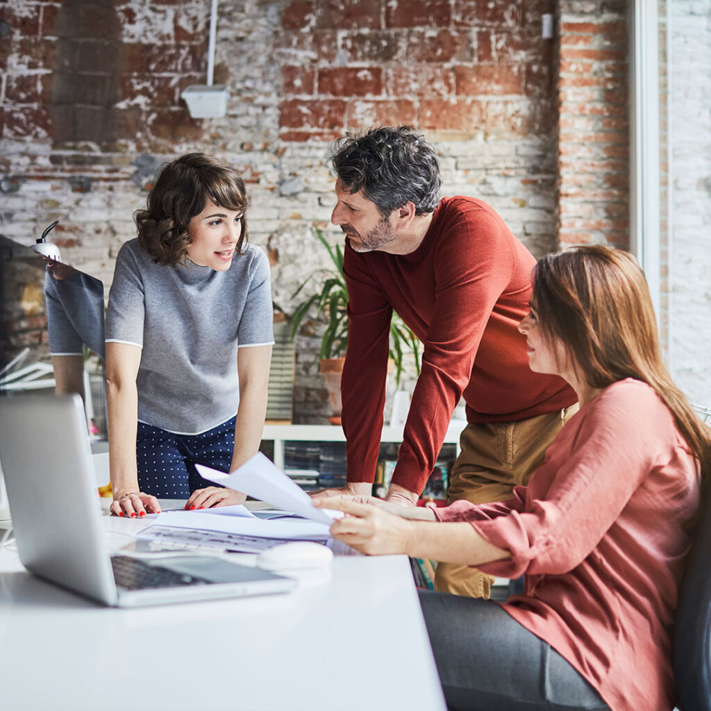 Small business employees talking together