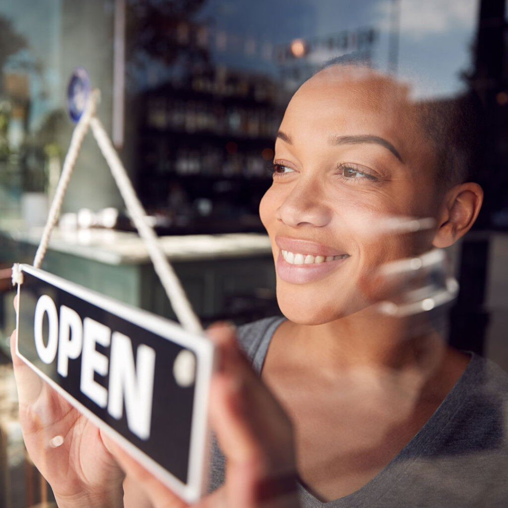 Small business owner open sign