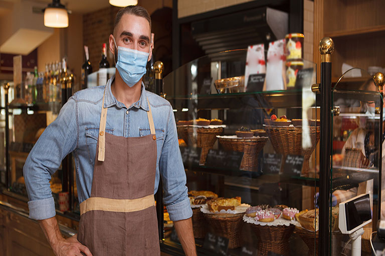small business owner or employee with mask