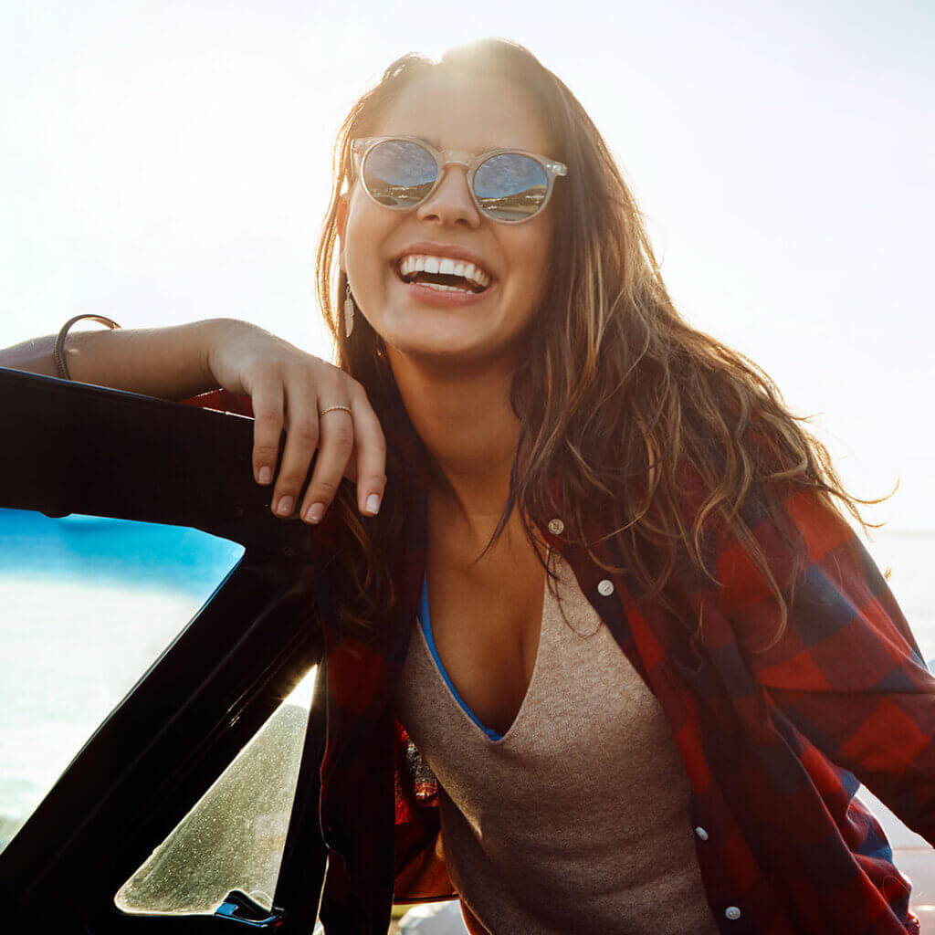 Woman outside smiling at the camera