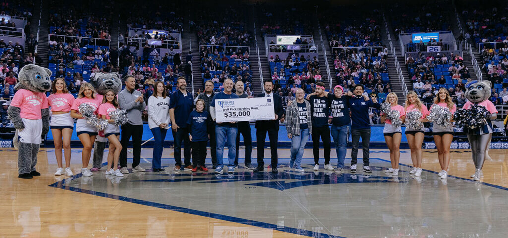 Check presentation to the Nevada Wolf Pack Marching Band at the Men's Basketball game on February 3, 2023