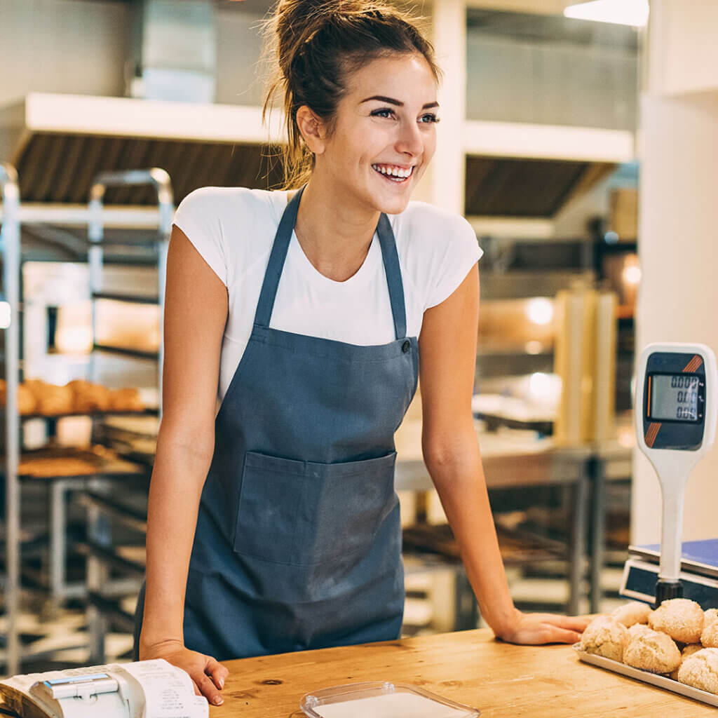 Female small business owner smiling