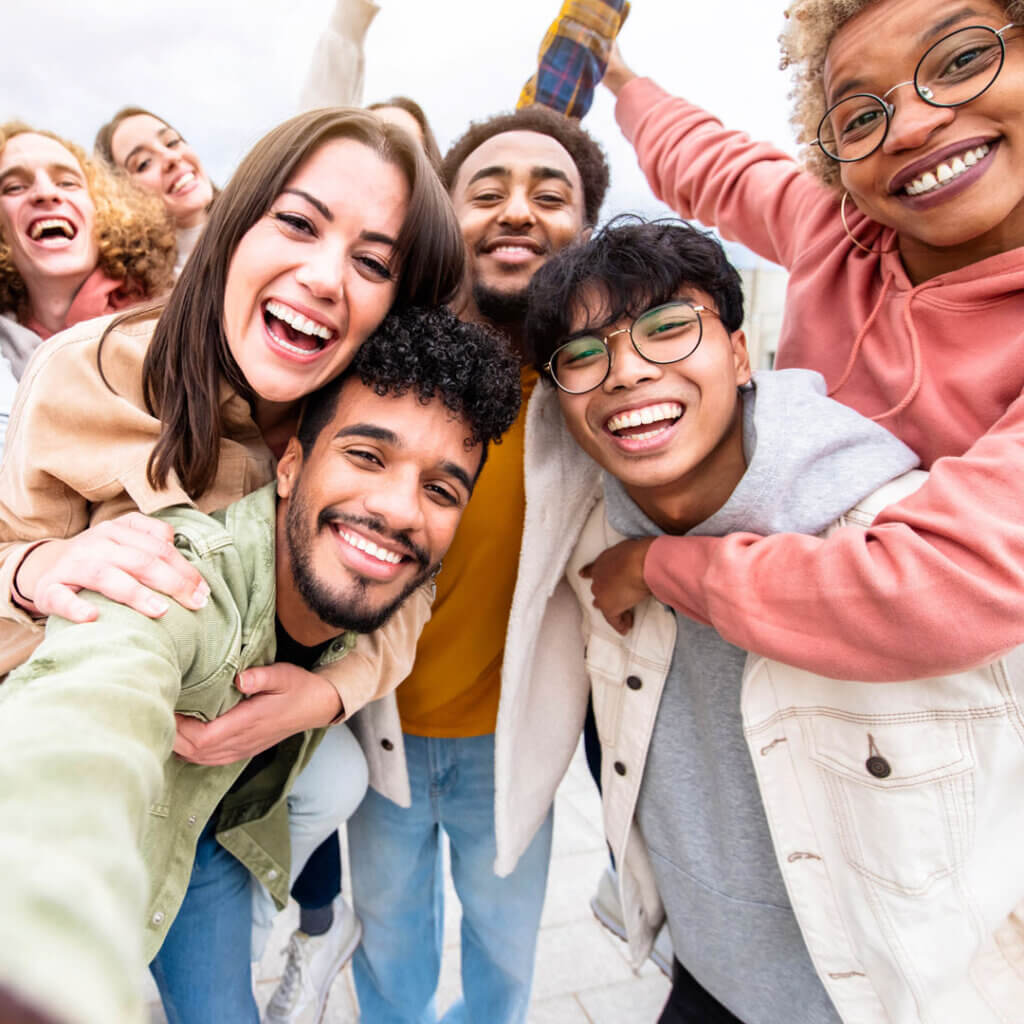 Group of people together smiling at the camera