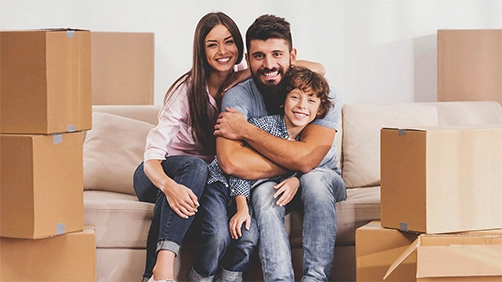 Family unpacking boxes together