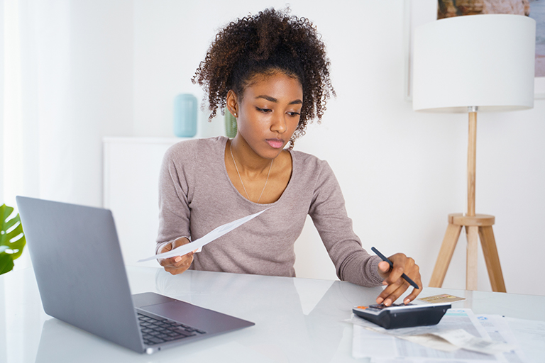 Young African-American woman budgeting