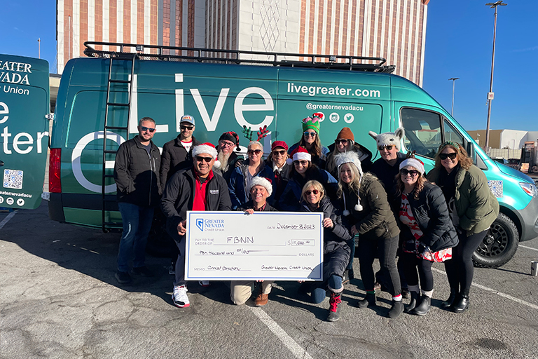 Group photo of employees dropping off donations from the 2023 Greater Giving Donation Drive