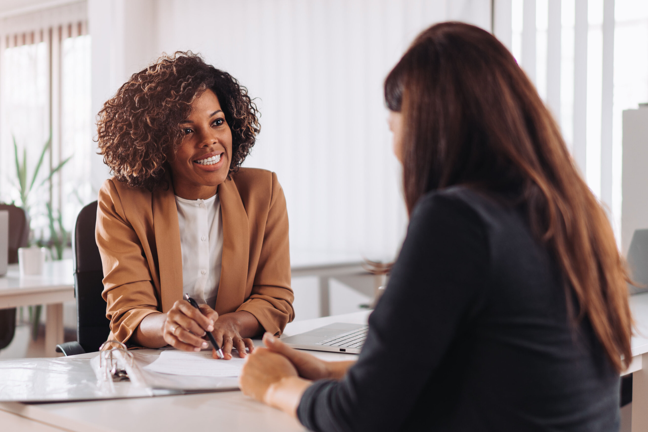 Two business partners talking as a constructive practice for healthy business relationships