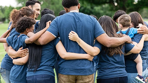 Group of people hugging together