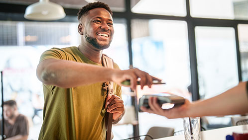 Man doing a mobile payment at a restaurant